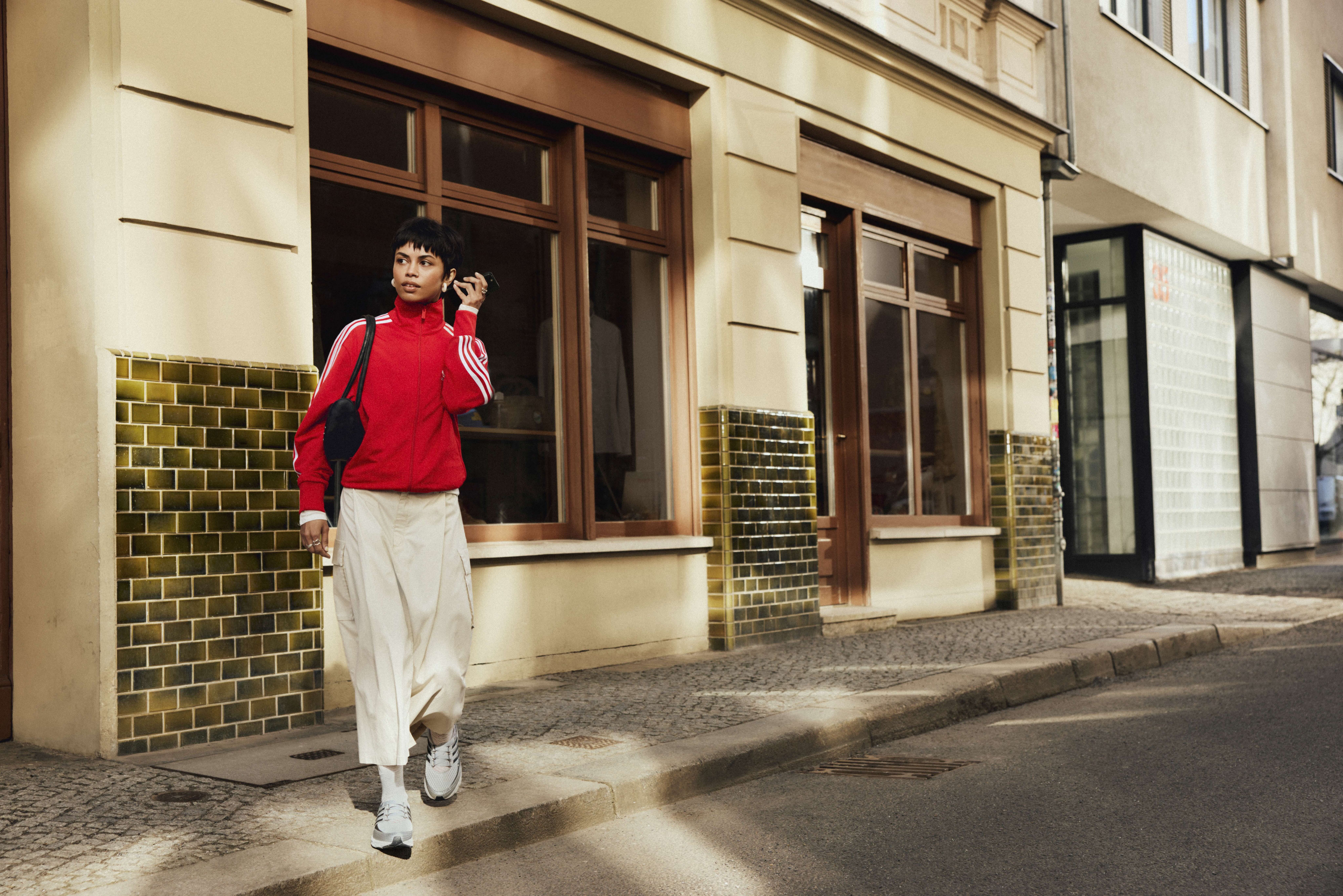 A model wearing an ADIDAS ORIGINALS streetwear look